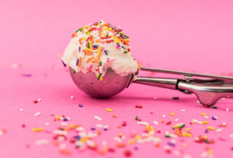 Ice cream scoop vanilla ice cream with colourful sprinkles