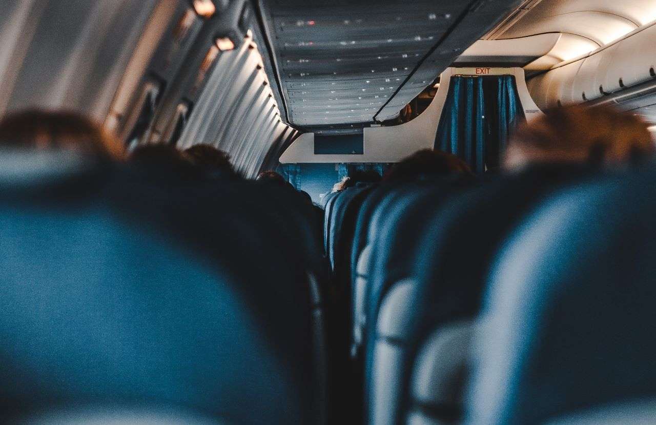 Inside a KLM airplane with blue leather seats