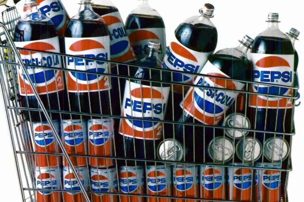 Many Pepsi cola bottles in a shopping cart