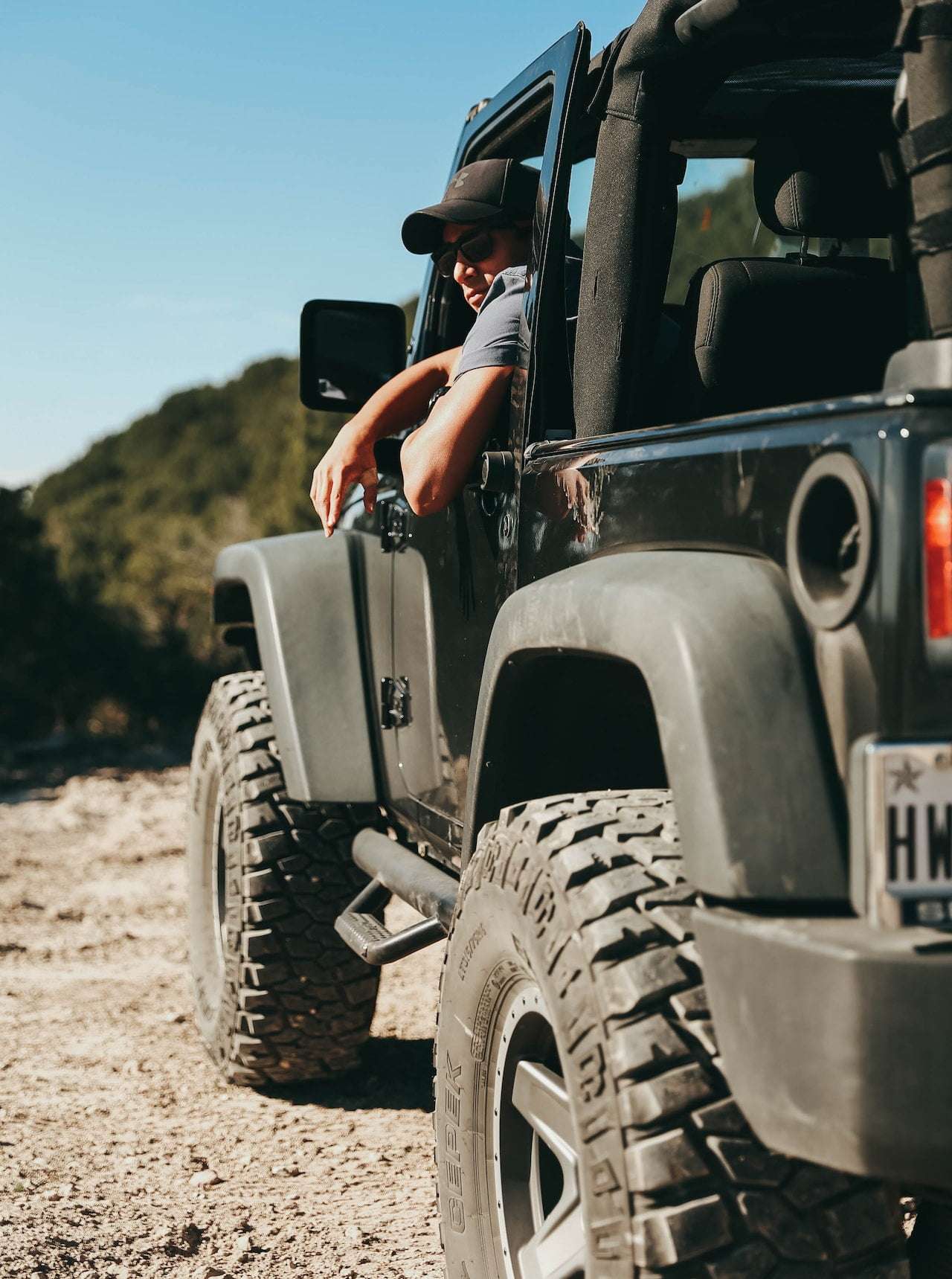 Man sitting in jeep in army fatigue