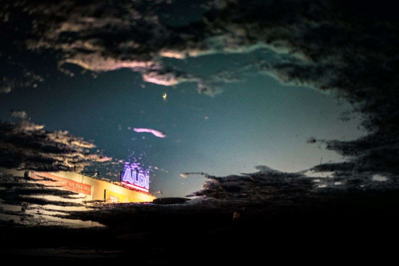 Aldi, a supermarket from Germany, logo lit up at night