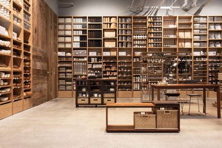 Inside a Muji store. The wooden cabinets with products perfectly aligned give a very organised, clean look and feel
