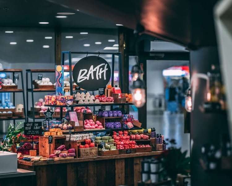 Inside a Lush shop with lots of soaps, bath materials