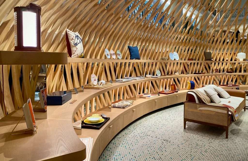 Hermès or Hermes products in one of their flagship shop. Include artisan products more plates, to pillows.