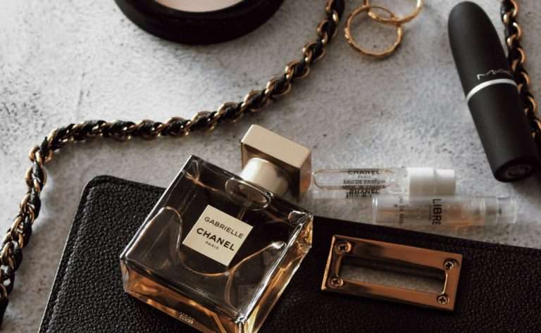 Chanel Gabrielle perfume golden rings, lipstick, and Chanel purse