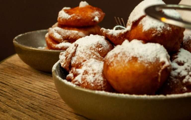 Traditional Dutch oliebollen with white powder sugar